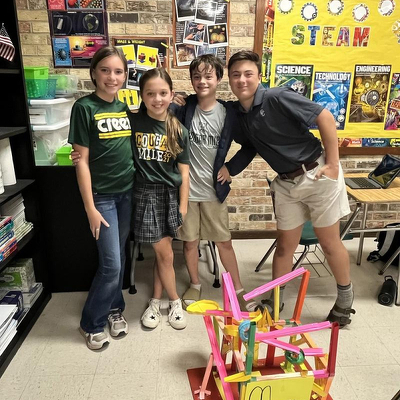 Middle Schoolers design and create marble rollercoasters.